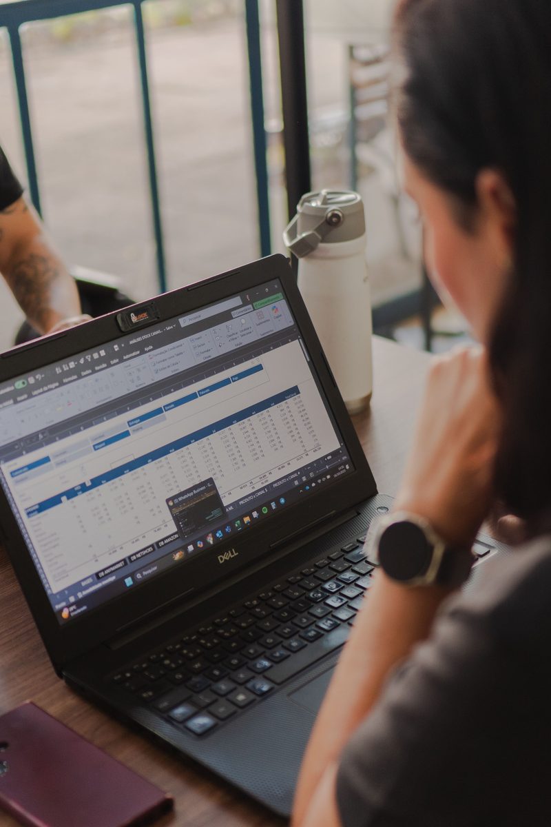 Person reviewing market information on a laptop